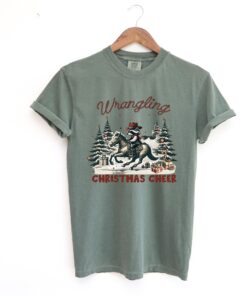 funny christmas shirt vintage cowboy raccoon tee with humorous design for holiday celebrations and unique style isqid scaled