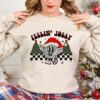 funny christmas shirt for kids feelin jolly toddler t shirt for holiday parties and family gatherings vintage style christmas apparel nowlr scaled