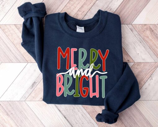 funny christmas shirt merry and bright sweatshirt with believe design for holiday celebrations and festive gatherings cgbht scaled