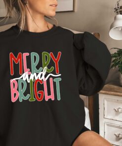 funny christmas shirt merry and bright sweatshirt with believe design for holiday celebrations and festive gatherings pbzq2 scaled