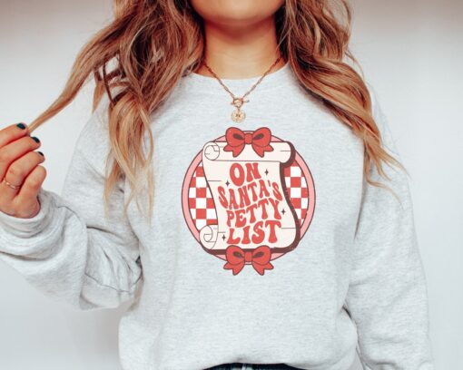 funny christmas sweater for women on santas petty list crewneck sweatshirt with unique holiday design sebso