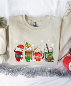 funny christmas sweatshirt for coffee lovers featuring winter snowman design and latte graphics jesfp scaled