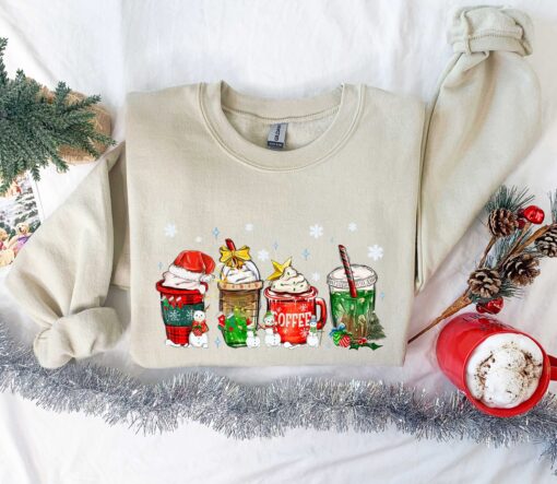 funny christmas sweatshirt for coffee lovers featuring winter snowman design and latte graphics jesfp scaled