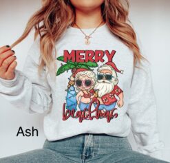 Funny Christmas Sweatshirt Merry Beachmas Shirt Tropical Xmas Design for Beach Vacation Mr and Mrs Claus Mele Kalikimaka Theme