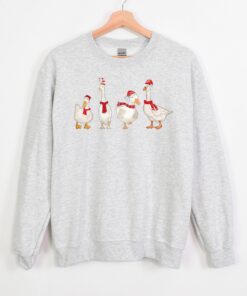 funny christmas sweatshirt with duck design for holiday celebrations and winter comfort unique duckmas shirt for festive wear khpcy scaled