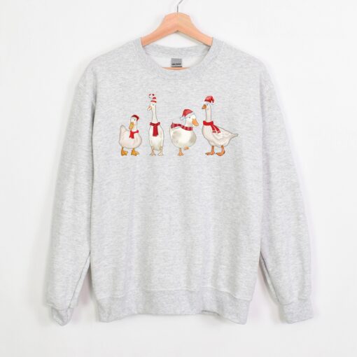 funny christmas sweatshirt with duck design for holiday celebrations and winter comfort unique duckmas shirt for festive wear khpcy scaled