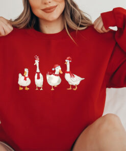 funny christmas sweatshirt with duck design for holiday celebrations and winter comfort unique duckmas shirt for festive wear rvkwm scaled