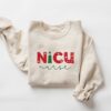 nicu nurse christmas sweatshirt with fun design for holiday spirit and comfort colors ideal for nicu nurses celebrating the season 6az7c