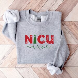 nicu nurse christmas sweatshirt with fun design for holiday spirit and comfort colors ideal for nicu nurses celebrating the season fwxwb