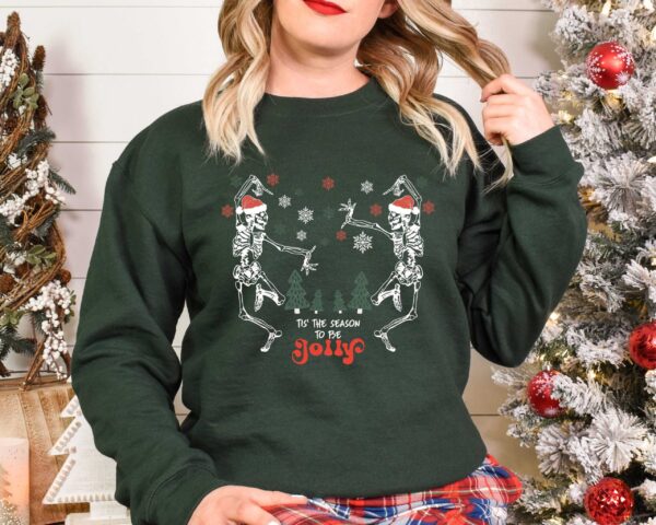 skeleton dance sweatshirt for christmas featuring jolly skeleton design and skull graphics in fun holiday colors tjpot scaled