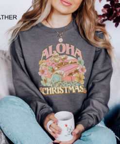 vintage aloha christmas sweatshirt featuring surfing santa design for hawaiian holiday celebrations and funny xmas party events pnvml