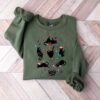 vintage black cat christmas sweatshirt for cat lovers featuring a fun holiday design ideal for xmas celebrations and cozy winter wear vdvf4 scaled