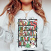 vintage bookish christmas sweatshirt for reading lovers with bookshelf santa design in soft comfortable fabric jmr8l