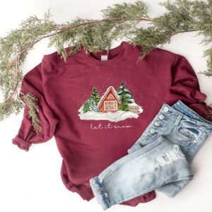 vintage christmas cabin sweatshirt with let it snow design for winter comfort and holiday style uria6