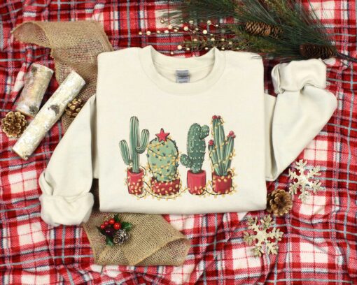 vintage christmas cactus t shirt for plant lovers featuring cowboy design and southern style holiday theme dep2d scaled