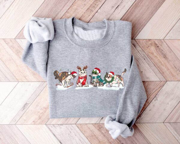 vintage christmas cat sweatshirt for cat lovers featuring various cat breeds and kittens ideal for holiday celebrations sjiev scaled