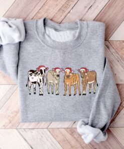 vintage christmas cow sweatshirt for women with highland cow design and festive lights crewneck style sxpts scaled