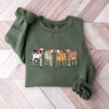 vintage christmas cow sweatshirt for women with highland cow design and festive lights crewneck style vy37i scaled