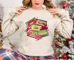 Vintage Christmas Music Sweatshirt Retro Design for Music Lovers Featuring Cassette Tapes and Classic Christmas Songs