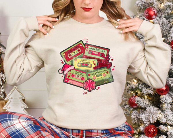 vintage christmas music sweatshirt retro design for music lovers featuring cassette tapes and classic christmas songs 5465x scaled