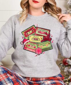 vintage christmas music sweatshirt retro design for music lovers featuring cassette tapes and classic christmas songs g17xy scaled