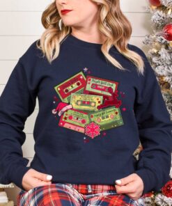 vintage christmas music sweatshirt retro design for music lovers featuring cassette tapes and classic christmas songs owbmf scaled