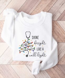 vintage christmas nurse sweatshirt shine bright like a call light merry nurse shirt with tree design for holiday cheer 8d0sn scaled