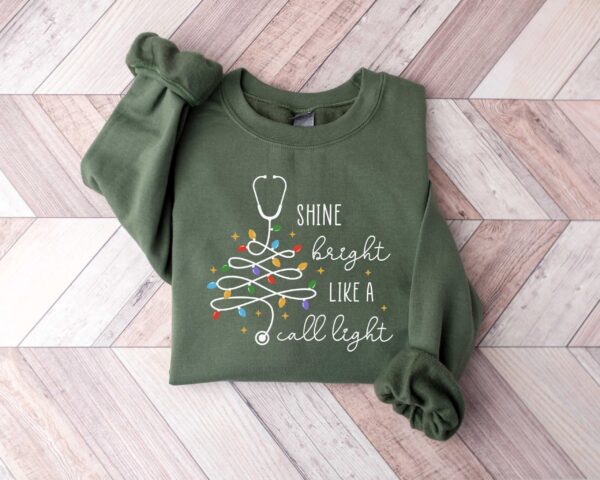 vintage christmas nurse sweatshirt shine bright like a call light merry nurse shirt with tree design for holiday cheer bzrw9 scaled