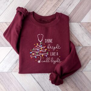 vintage christmas nurse sweatshirt shine bright like a call light merry nurse shirt with tree design for holiday cheer gms9e scaled