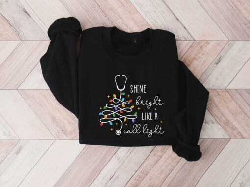 vintage christmas nurse sweatshirt shine bright like a call light merry nurse shirt with tree design for holiday cheer houdk scaled