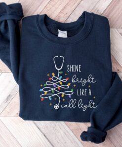 vintage christmas nurse sweatshirt shine bright like a call light merry nurse shirt with tree design for holiday cheer rlk4a scaled