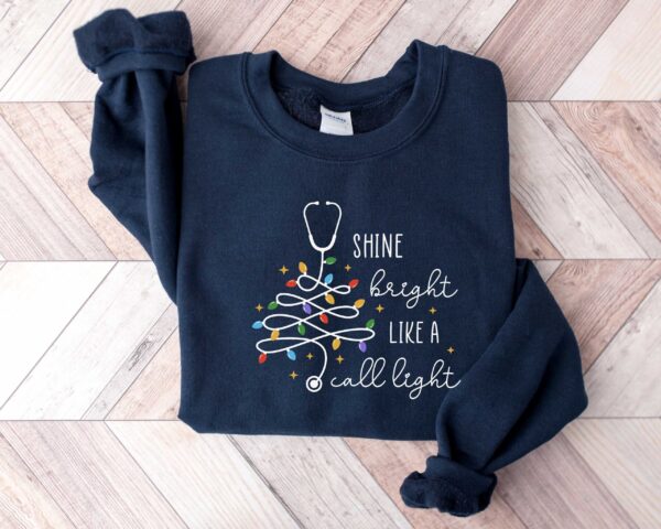 vintage christmas nurse sweatshirt shine bright like a call light merry nurse shirt with tree design for holiday cheer rlk4a scaled