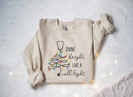 vintage christmas nurse sweatshirt shine bright like a call light merry nurse shirt with tree design for holiday cheer yrlse scaled