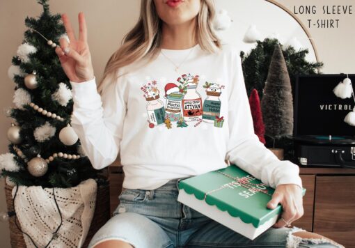 vintage christmas nurse t shirt for medical professionals featuring fun medication design long sleeve crew style nucmp scaled