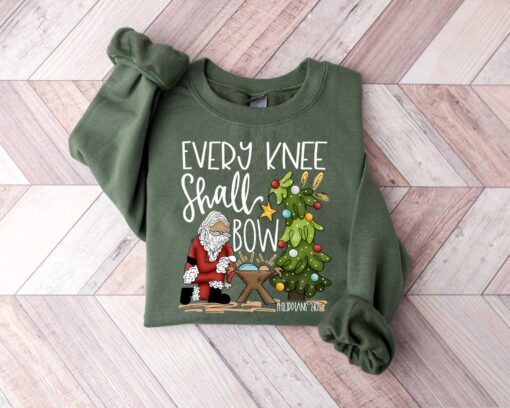 vintage christmas sweatshirt every knee shall bow design featuring jesus and nativity scene for christian apparel enthusiasts