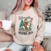 vintage christmas sweatshirt featuring cowboy santa design for western style festivities and holiday celebrations gcbci