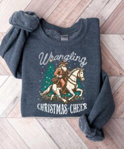 vintage christmas sweatshirt featuring cowboy santa design for western style festivities and holiday celebrations rbphg