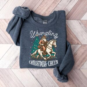 vintage christmas sweatshirt featuring cowboy santa design for western style festivities and holiday celebrations rbphg