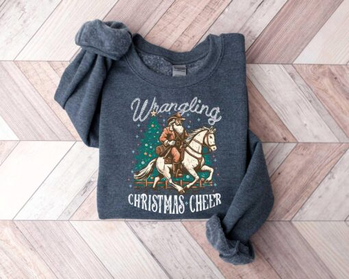 vintage christmas sweatshirt featuring cowboy santa design for western style festivities and holiday celebrations rbphg