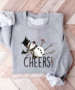 vintage christmas sweatshirt featuring drunk snowman drinking wine for winter holiday celebrations and festive style 8llzj scaled