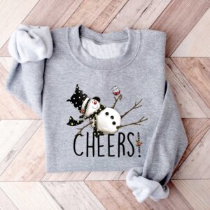 vintage christmas sweatshirt featuring drunk snowman drinking wine for winter holiday celebrations and festive style 8llzj scaled