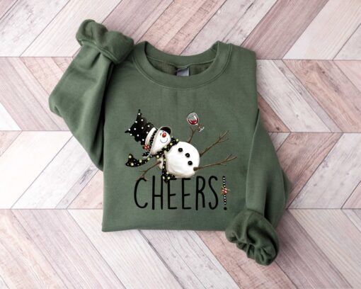 vintage christmas sweatshirt featuring drunk snowman drinking wine for winter holiday celebrations and festive style m8uac scaled