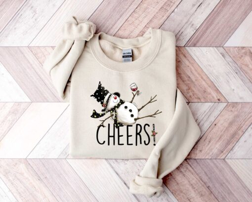 vintage christmas sweatshirt featuring drunk snowman drinking wine for winter holiday celebrations and festive style tc7jv scaled