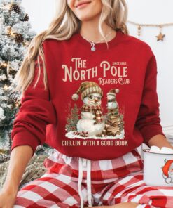 vintage christmas sweatshirt featuring north pole book club snowman design for book lovers and retro book worms pez8l scaled