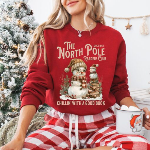 vintage christmas sweatshirt featuring north pole book club snowman design for book lovers and retro book worms pez8l scaled