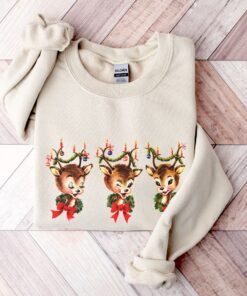 vintage christmas sweatshirt featuring reindeer design for holiday parties and festive gatherings pfkul