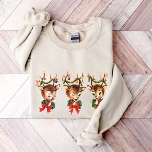 vintage christmas sweatshirt featuring reindeer design for holiday parties and festive gatherings pfkul