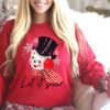 vintage christmas sweatshirt featuring retro snowman design for holiday parties and festive gatherings uchxq