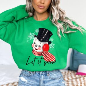 vintage christmas sweatshirt featuring retro snowman design for holiday parties and festive gatherings ykrnx