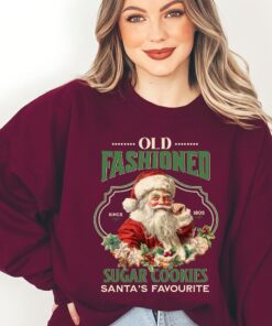 vintage christmas sweatshirt featuring santa claus and sugar cookies for a retro holiday look 9up19